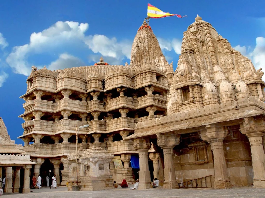 The carved stone spires and pillared facade of Dwarkadhish Temple in Dwarka