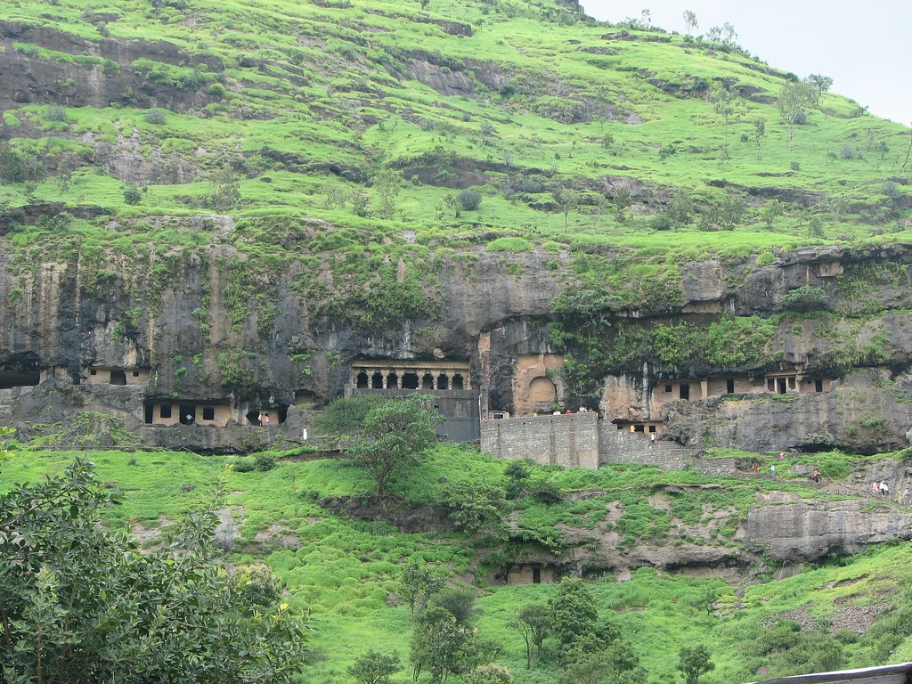 The Lenyadri caves, home to the Girijatmaj temple, cut into a green hillside