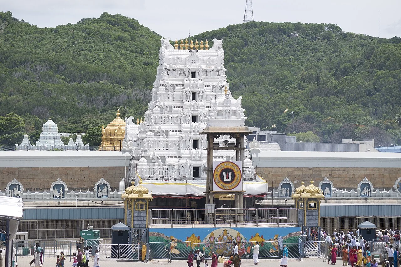 The white entrance tower and courtyard of Sri Venkateswara Temple in Tirumala